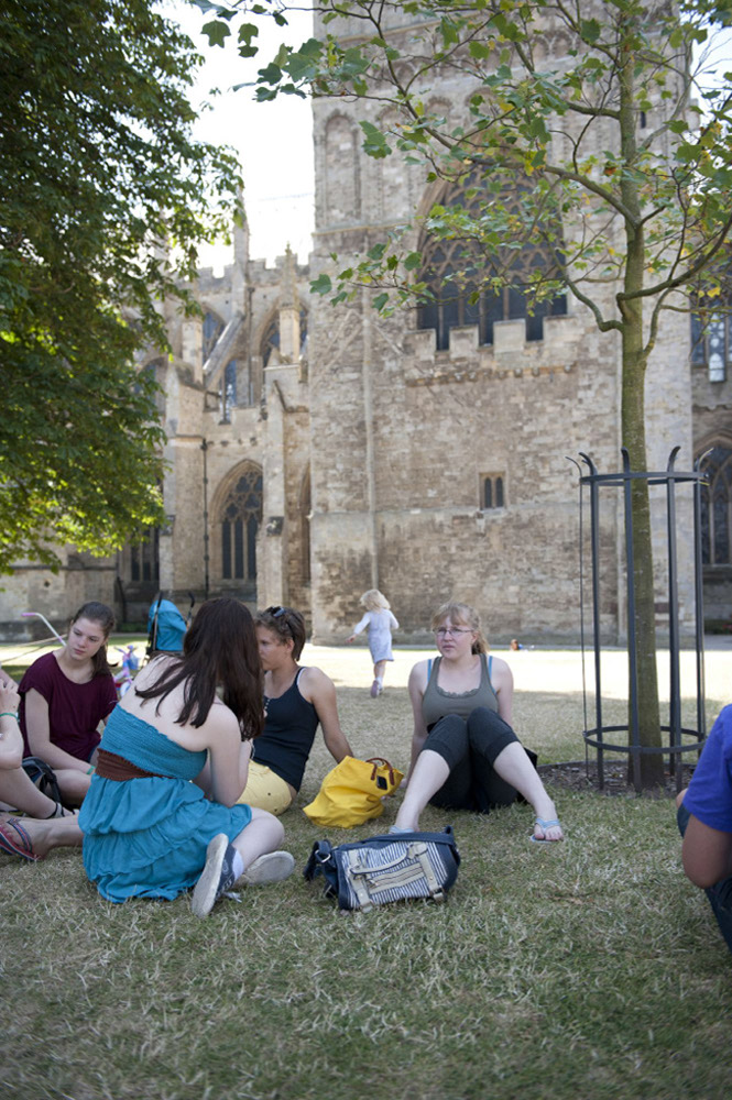 %_tempFileNameexeter-town-students-sitting-at-the-grass%
